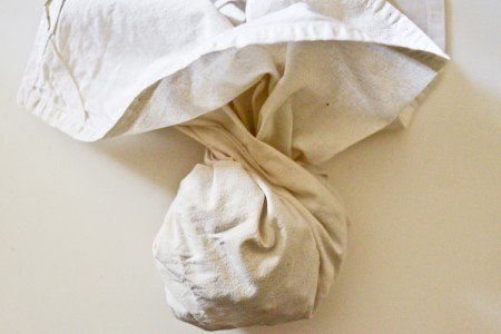 Roasted hazelnuts in bundled towel